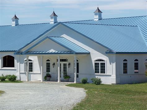 sand colored house blue metal roof|blue metal roof house.